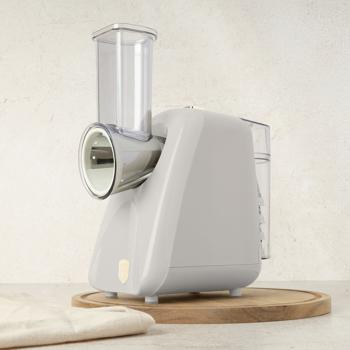 Preview: Elektrische Küchenreibe - 5 scharfe Edelstahl-Aufsätze zum Hobeln, Hacken & Reiben von Obst/Gemüse/Nüssen - 150W Leistung, creme - Zerkleinerer für Küche